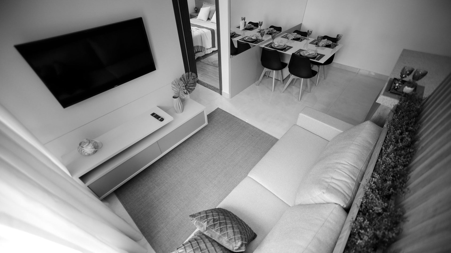 Sala e copa integradas de um imóvel residencial